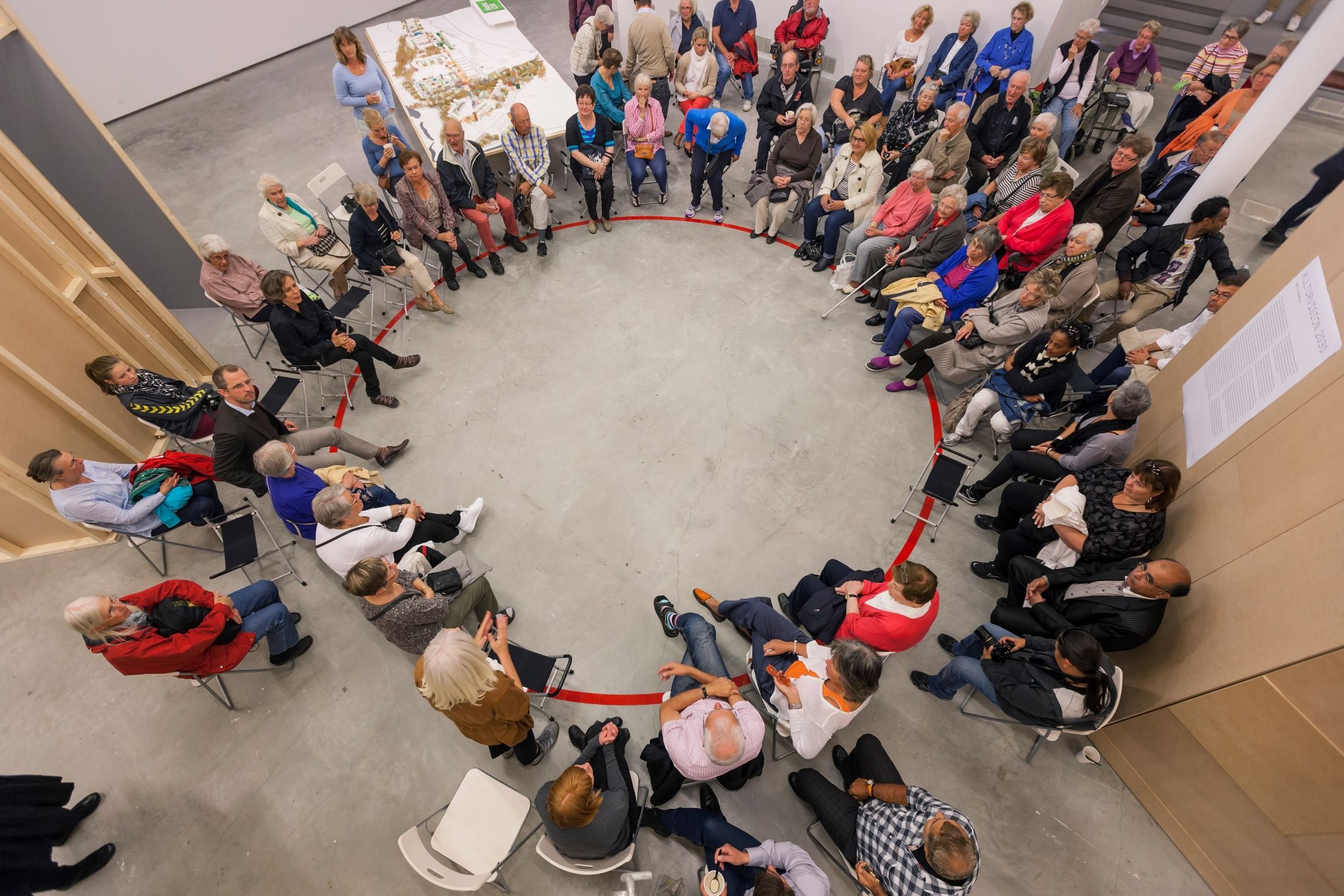 a circle of residents convened by the artist to discuss the shaping and design of their community