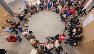a circle of residents convened by the artist to discuss the shaping and design of their community