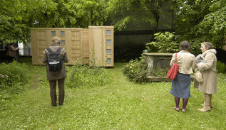 A wooden sculpture situated temporarily in St John's Cemetery 