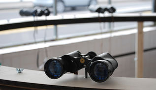 Circular structure with binoculars inside bridge cabin